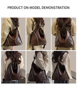 Détail du grand sac cabas marron montrant les styles portés à l'épaule et en sac à dos