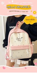 Detail showing the transparent zipper pocket and cute cartoon pattern on the pink backpack