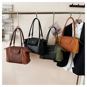 Detail showing various colors of large-capacity corduroy and leather travel tote bags