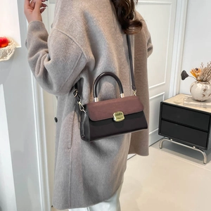 2025 stylish color-block handbag with gold twist lock and adjustable shoulder strap