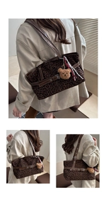 Detail of leopard print tote bag with brown faux leather straps and plush bear charm
