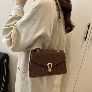 Women's leopard print shoulder bag with gold chain and metal lock closure in autumn style