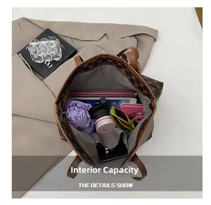 Macro view of large tote bag interior showing ample space for iPad, umbrella and wallet