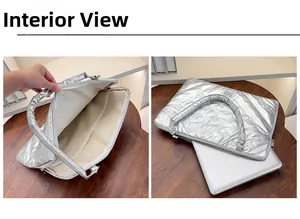 Silver quilted laptop sleeve featuring dual interior compartments for organized storage