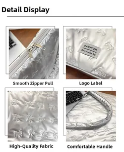 Detail shots of silver bow-embossed laptop sleeve with metal zipper and fashion label