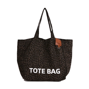 Minimalist large capacity leopard print canvas tote bag with white text and leather tag