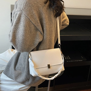 Minimalist white rectangular crossbody bag with golden clasp and dual strap options