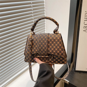 Vintage brown geometric printed tote bag with light gold hardware and adjustable strap