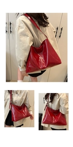 Three-angle views showing the glossy red patent leather finish and slouchy tote bag shape