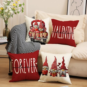 Four-pack Valentine's Day pillow covers with gnomes and love letter designs on sofa