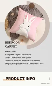 Close-up of pink velvet pillowcase featuring white rabbit embroidery and soft fabric texture