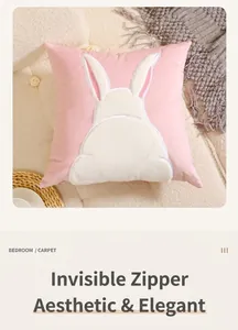 Detail of invisible zipper and soft velvet embroidery on pink rabbit throw pillow