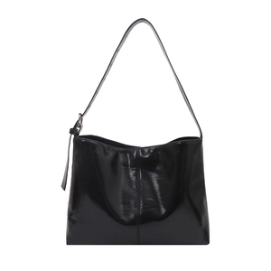 Glossy black faux leather shoulder bag with silver buckle and vertical seam for daily commute