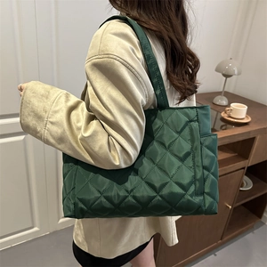 Deep green quilted tote bag with diamond stitching for women commute and casual style