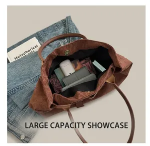 Top-down view of brown corduroy tote bag showing interior storage and magnetic closure