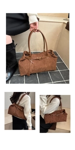 Detailed view of brown corduroy tote bag showing ribbed texture and leather straps