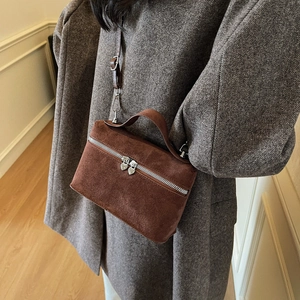 Dark brown suede square handbag with heart-shaped silver zippers and adjustable shoulder strap