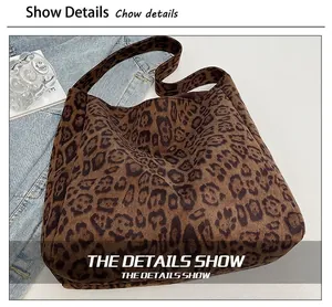 Close-up of leopard print tote bag with soft suede texture and wide shoulder strap