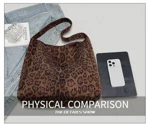 Leopard print tote bag shown with books and tablet for size comparison