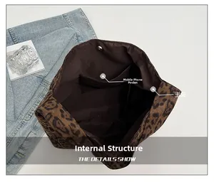 Detailed interior of leopard print tote bag showing phone pocket and magnetic closure