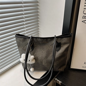 Retro charcoal canvas tote bag with black handles and white cloud plush charm detail