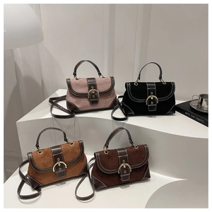 Detail view of retro suede patchwork crossbody bags in four colors with gold buckle