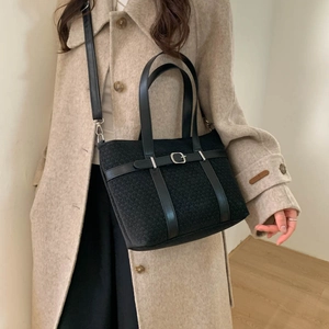 Retro black knit tote bag with leather straps and adjustable shoulder belt for women