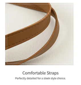 Detail of premium brown leather shoulder straps with reinforced stitching on a chic bag