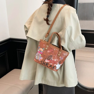 Sac cabas en cuir marron avec graffitis de dessins animés colorés et bandoulière réglable