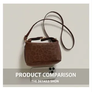 Leopard print crossbody bag size comparison with smartphone and art magazine props