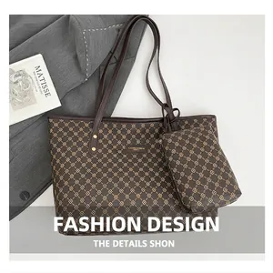 Flat lay of brown monogram tote bag set with leather straps and gold pattern detailing