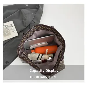 Top-down detail of large capacity tote bag interior with iPad, umbrella and daily items
