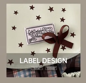 Detail of mint green fabric with star pattern, Yummy label, and brown ribbon bow