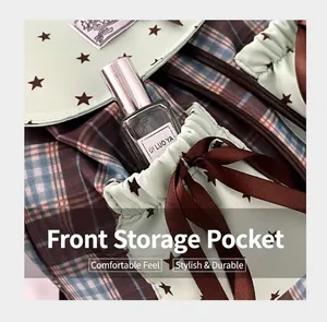 Detail of mint green star print and plaid fabric on backpack with drawstring pocket