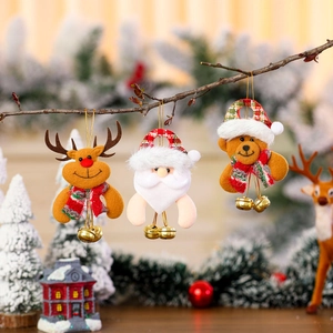 Christmas plush ornaments with bells featuring Santa, reindeer, and bear figures on tree