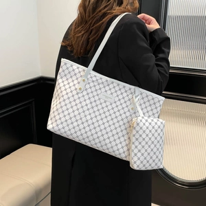 Chic monogram tote bag set in white with black geometric patterns for women