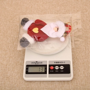 Detailed view of handmade Santa plush ornament weighing 13g for Christmas decor