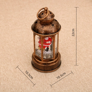 Detail showing 22cm Christmas lantern with Santa Claus figurine and star cutouts