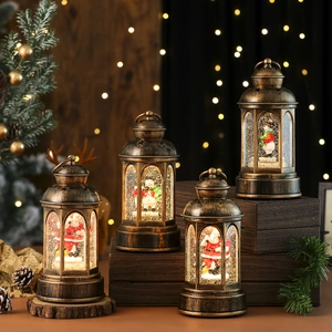 Vintage bronze Christmas lantern with Santa Claus and snowman figurines and LED light