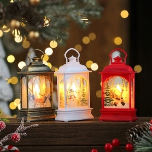 Three Christmas LED lanterns in bronze, white, and red with Santa and snowman patterns