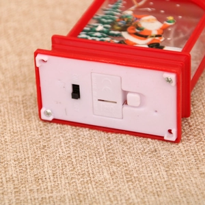 Close-up of the bottom switch and CE certification on a red Santa Claus lantern
