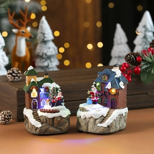 Scena del villaggio di Natale rotante a LED con case innevate in resina e Babbo Natale
