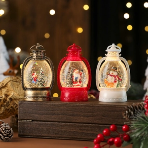 Three vintage Christmas lanterns with LED lights and snow globe effects in festive setting
