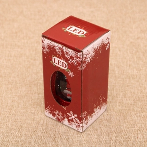 Detail of Christmas LED lantern packaging featuring Santa Claus design and snowflake patterns
