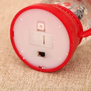 Detail of the bottom battery compartment and ON/OFF switch of Christmas lantern