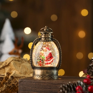 Close-up of bronze vintage Christmas lantern with Santa scene and swirling glitter water