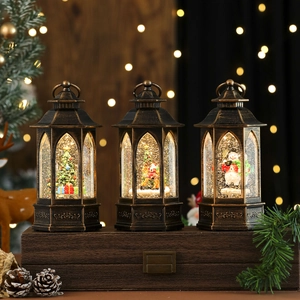 Three vintage Christmas lanterns with swirling glitter, Santa and snowman, festive home decor