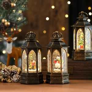 Detailed view of vintage bronze Christmas lanterns with snow globes and festive scenes