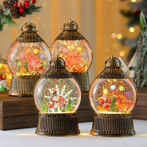 Vintage bronze Christmas lantern with spinning snow globe and Santa Claus scene