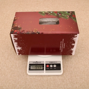 Exquisite red Christmas gift box with pine branch patterns and carry handle packaging